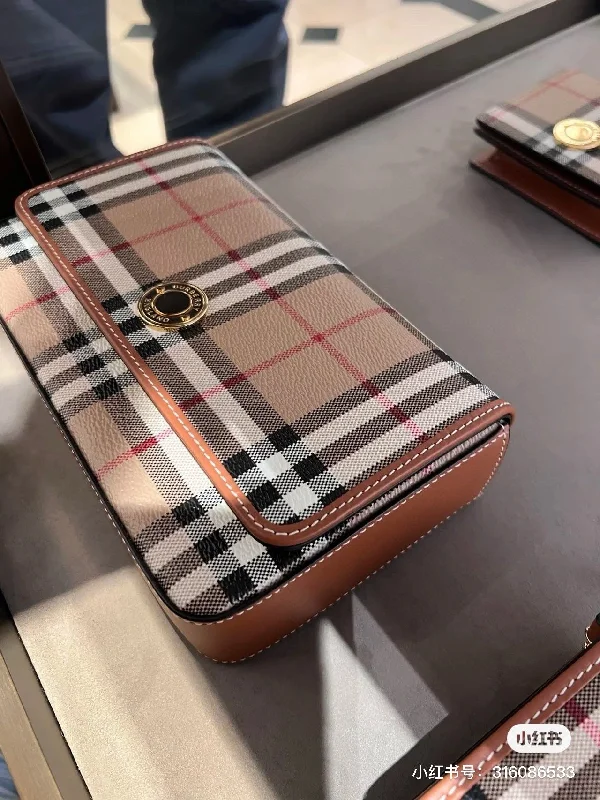 Burberry's cute little plaid mailman bag